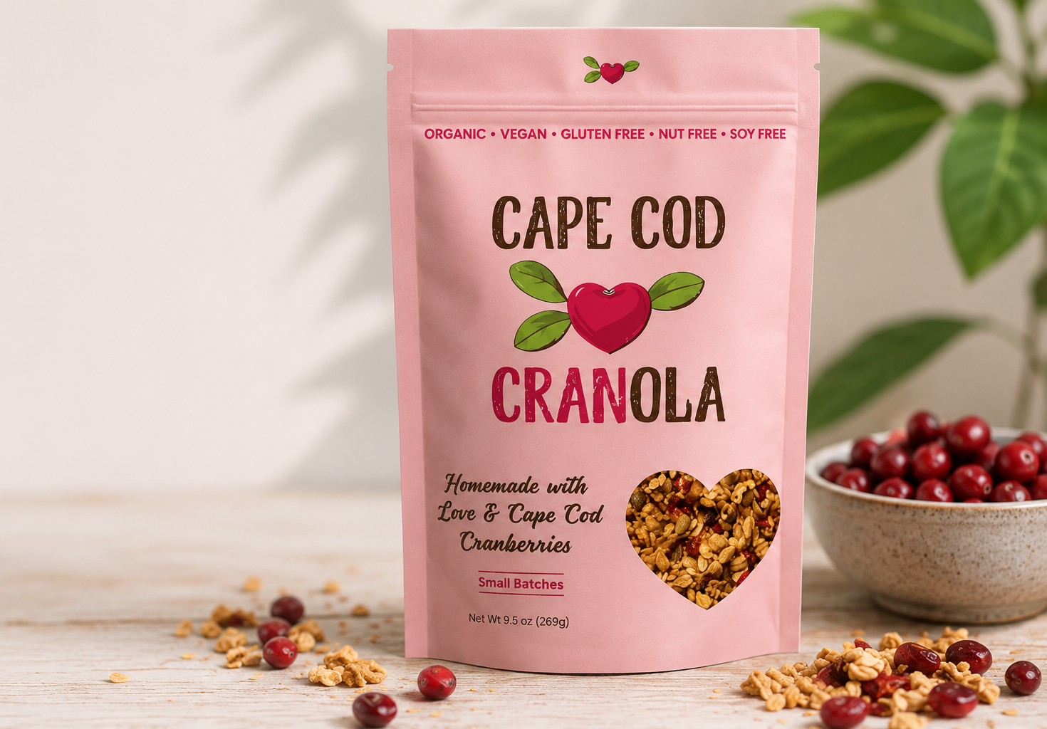 Cape Cod Cranola handcrafted organic cranberry granola package on a rustic kitchen table.